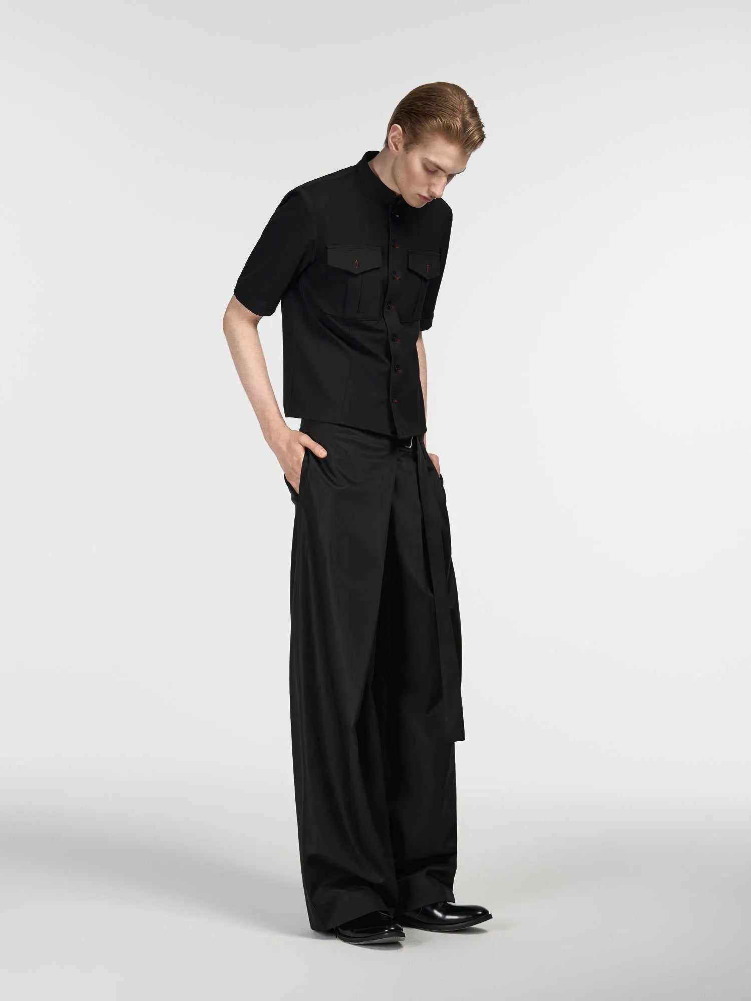 Black women's straight-leg trousers with a single front pleat and adjustable waistband.