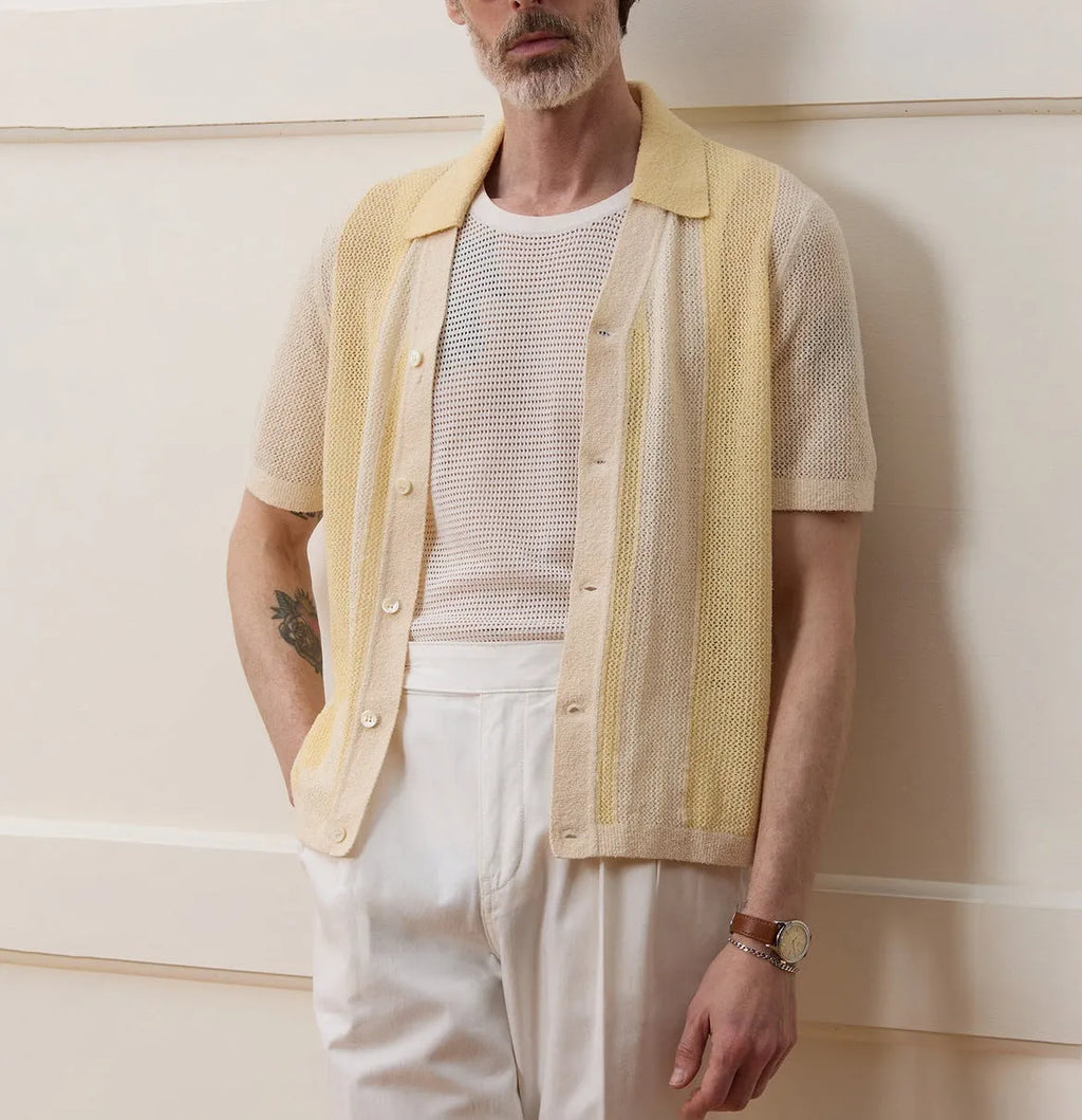 Yellow asymmetric hollow-out short sleeve polo shirt made from Tencel fabric on a model.