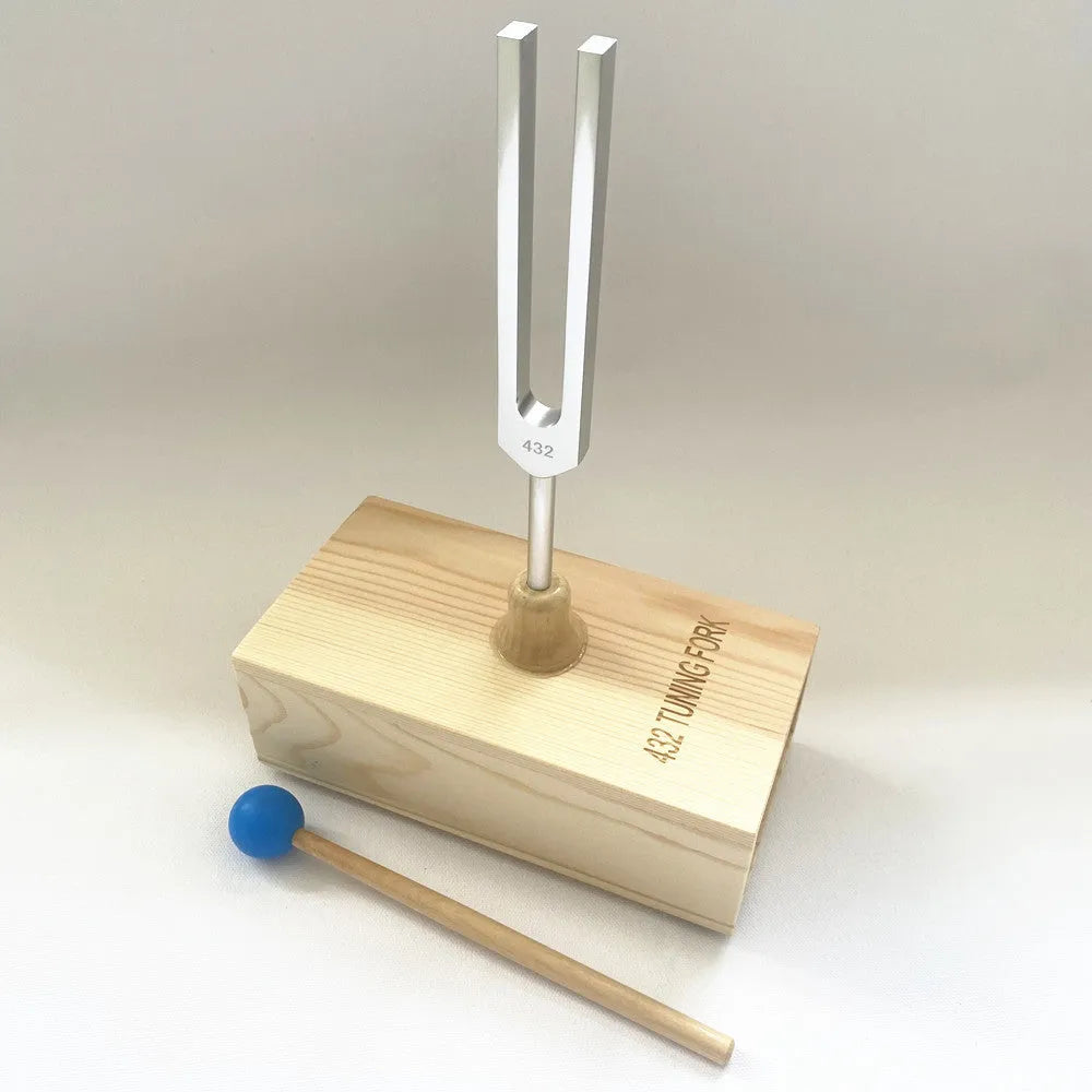 Aluminium alloy 432Hz tuning fork and speaker set on kraft paper box