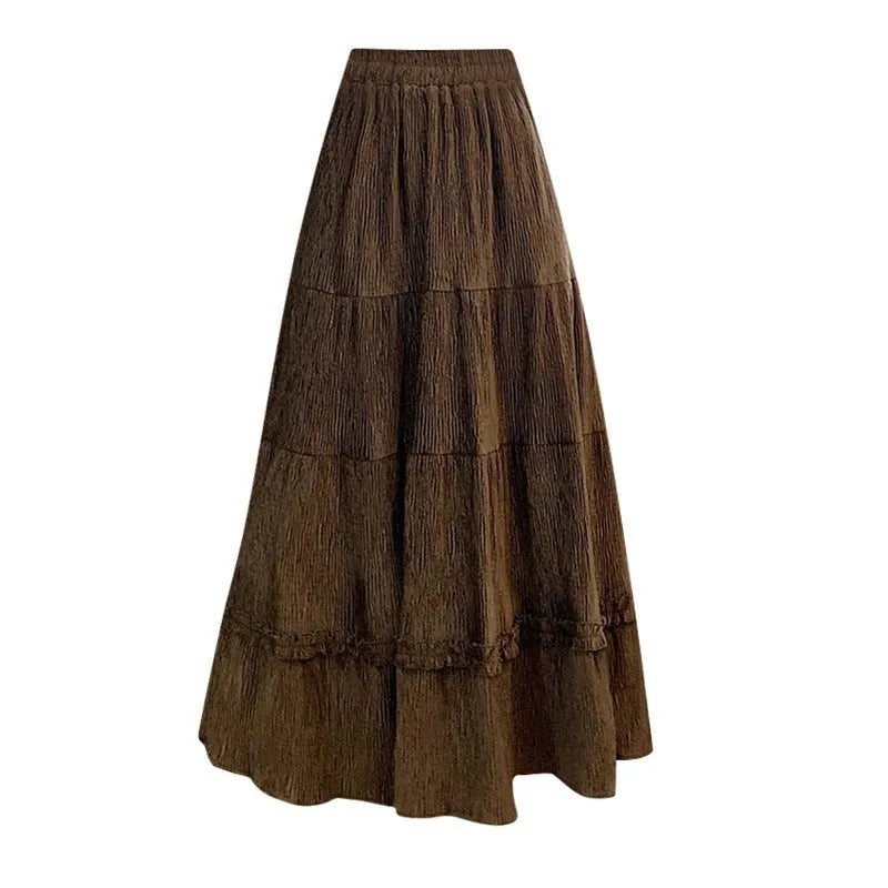 Korean style corduroy A-line midi skirt with elastic waistband in solid colour on hanger.