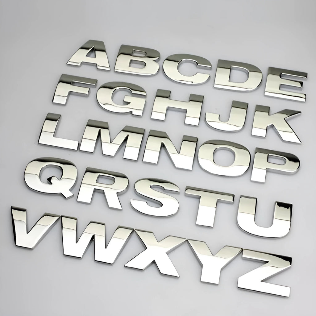 Metal zinc alloy car bumper sticker showing 2.5cm English letter on black background