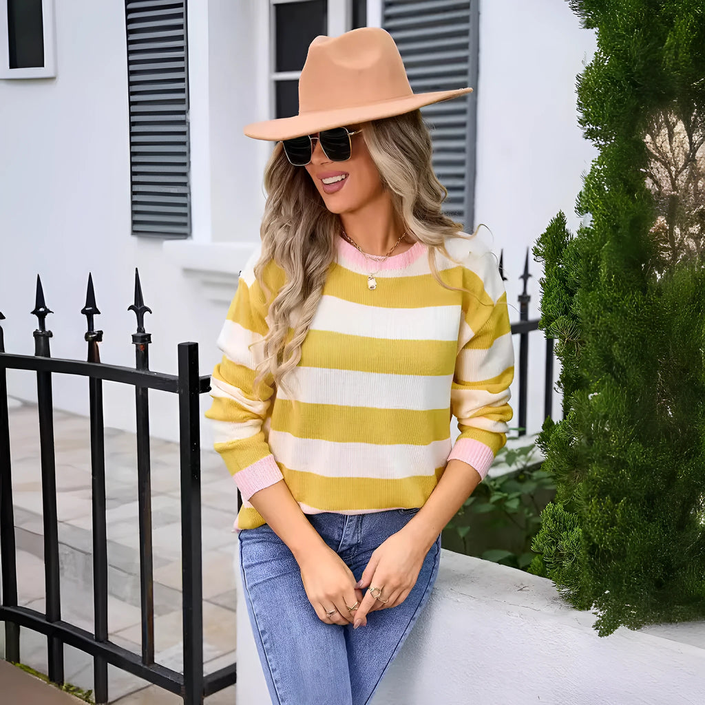 Women's loose fit long sleeve round neck sweater in a striped pattern, shown in a blue colour option.