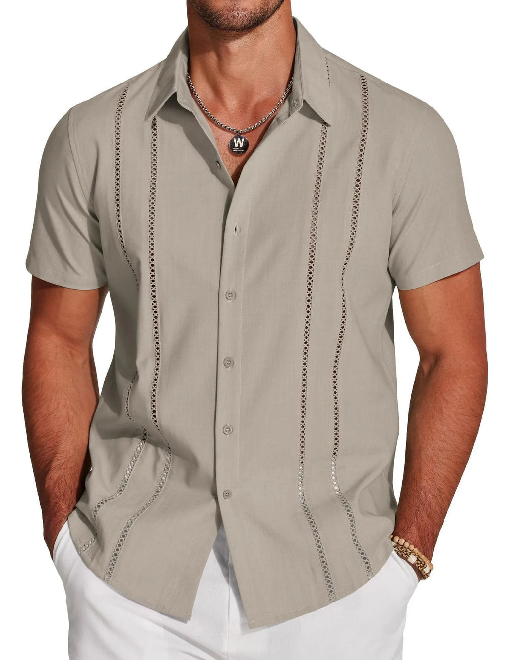Man wearing a slim fit, short sleeve Hawaiian shirt with a digital print pattern.