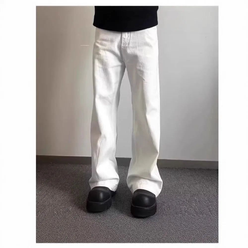 Men's white denim jeans with loose straight wide leg cut and mid waist