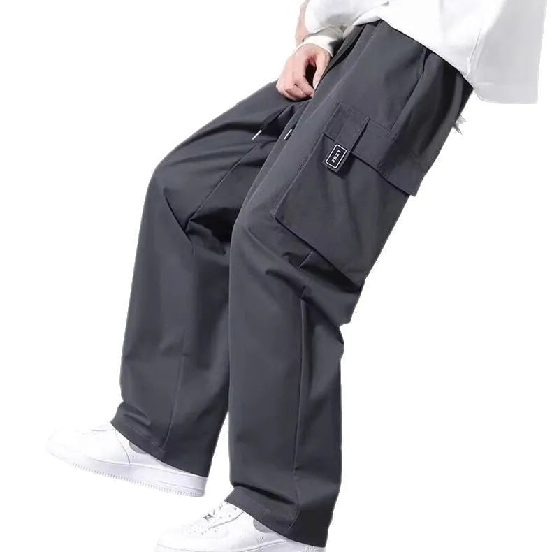 Boys straight leg cargo pants with drawstring waist and large side pockets in polyester fabric