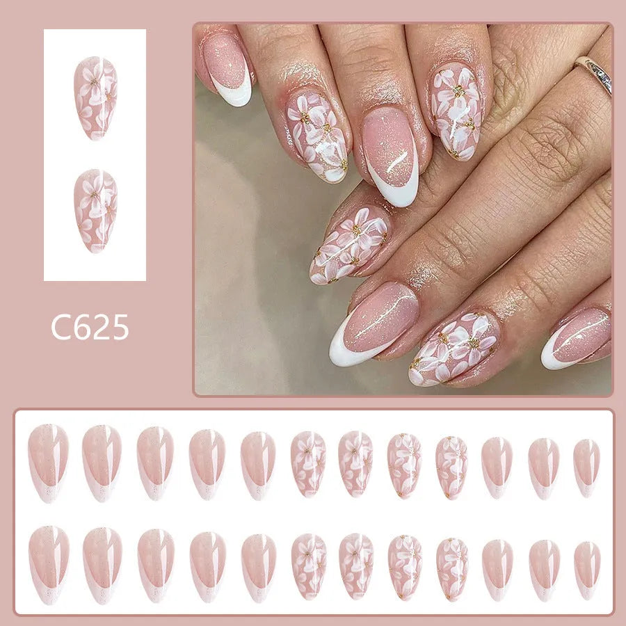 C625 short glossy almond fake nails with French manicure, glitter, and pink powder flowers.