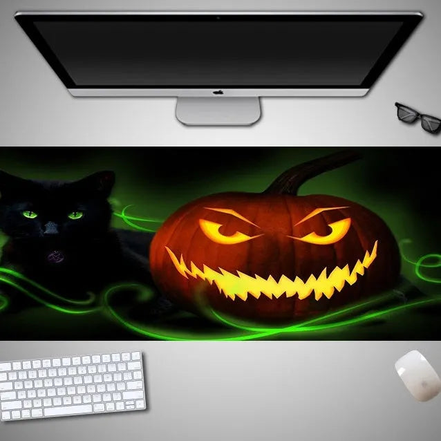 Oversized Halloween-themed mouse pad with non-slip rubber cloth base on a desk