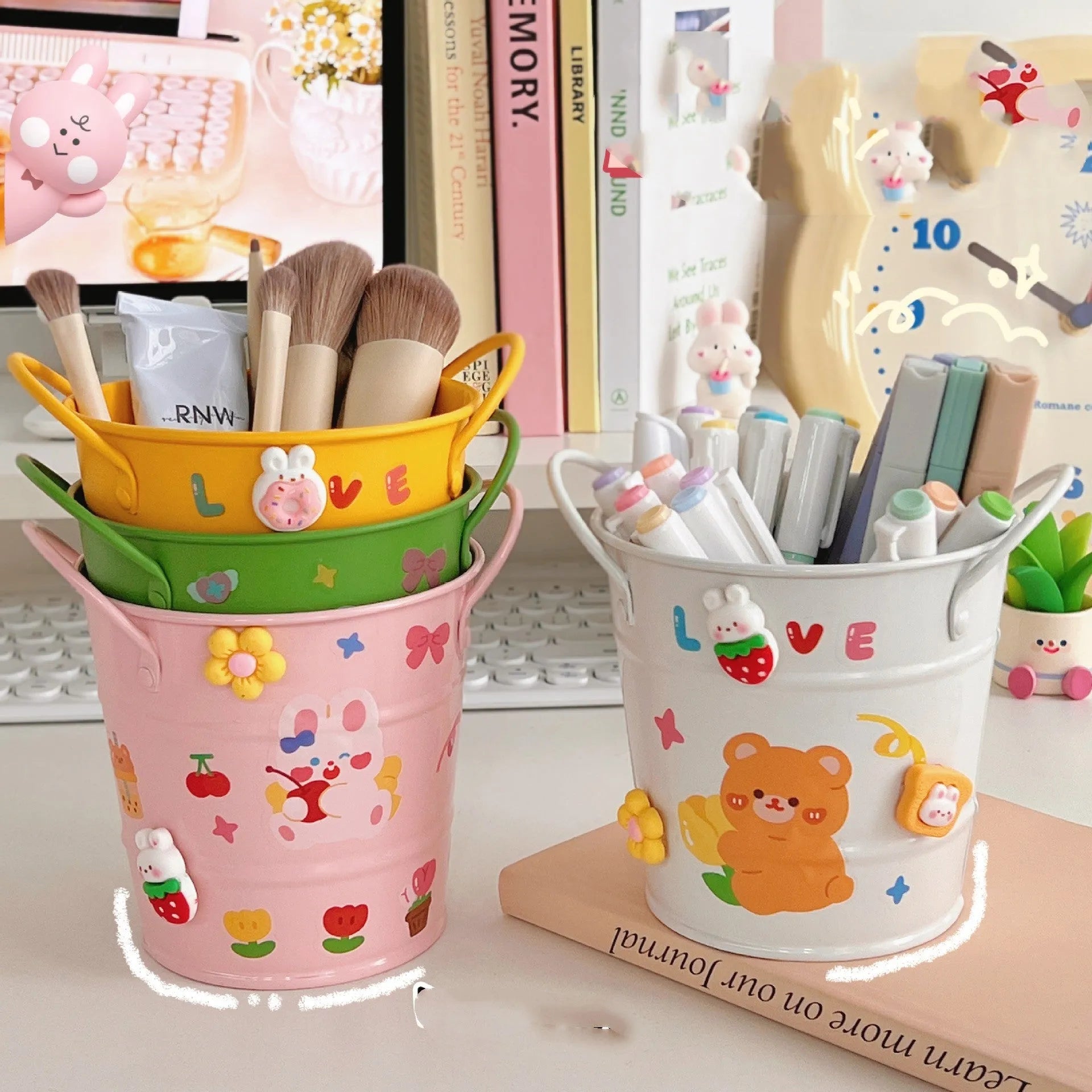 Round metal desk pen holder in a choice of colours, some with decorative sticker patches, for student stationery organisation.