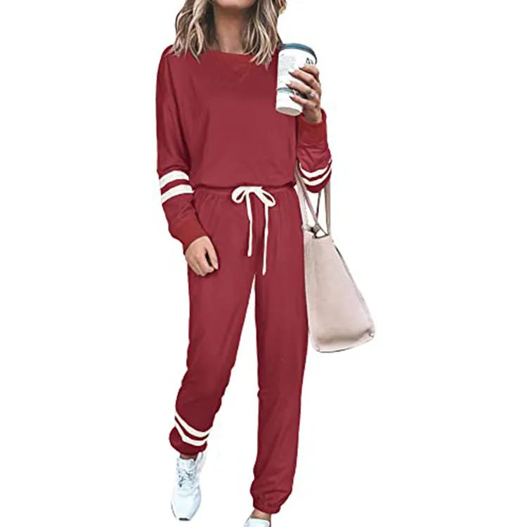 Women's loose-fitting plus size casual suit in a solid colour, featuring a half-sleeve top and trousers.