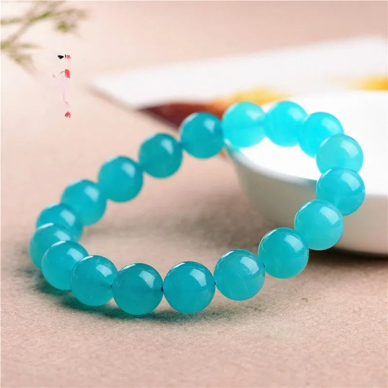Grade 7A Amazonite natural stone bracelet with polished ice-colour beads on a black elastic cord.