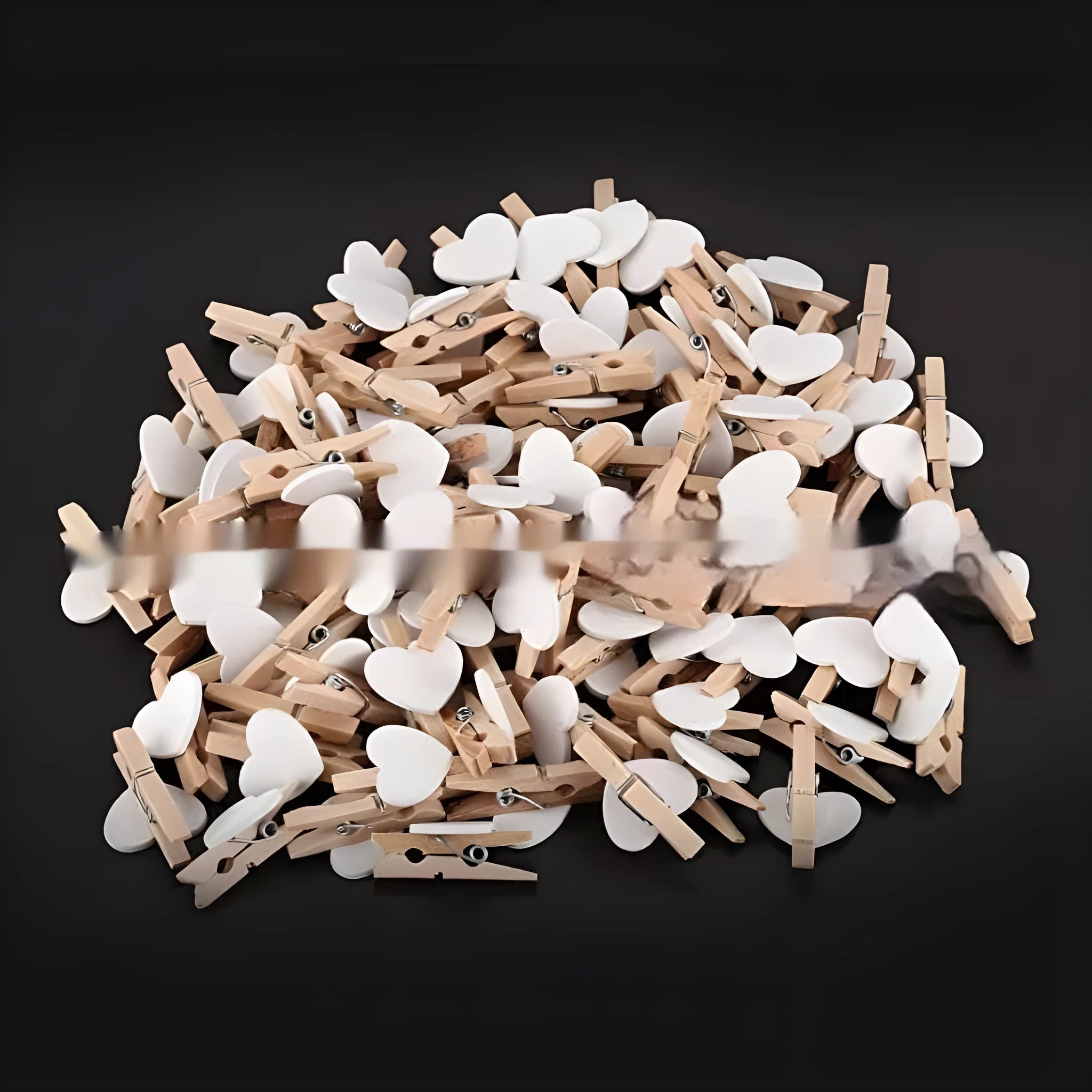 Set of five handmade solid wood heart-shaped clips in red, pink, white, and yellow on a wooden surface.