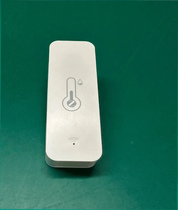 Compact white WiFi temperature and humidity sensor with digital display on ABS plastic case.