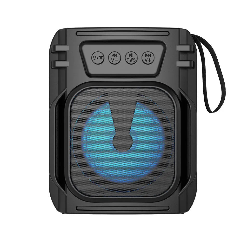 Small portable Bluetooth speaker in colour 3107 with USB charging cable on a desk