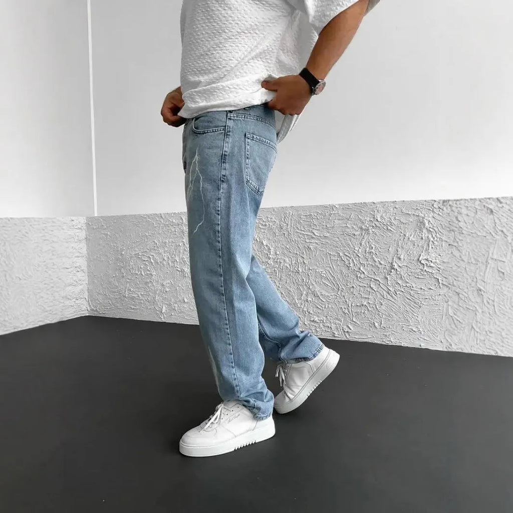 Men's blue straight-leg denim jeans with wide-leg silhouette and mid-waist design