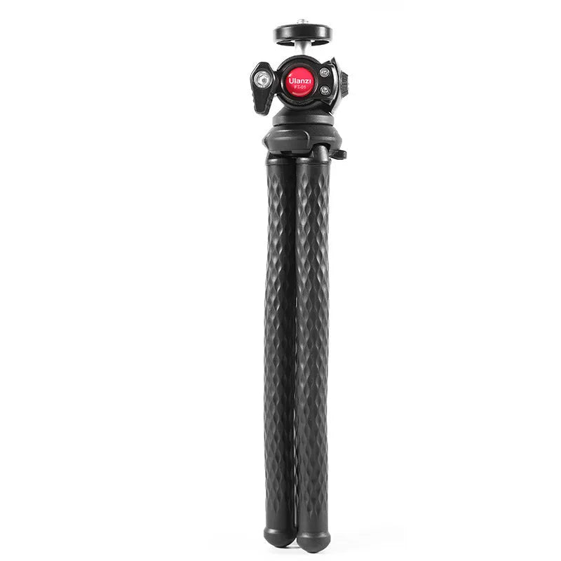 Black octopus-style flexible tripod with mobile phone clip extended on a table.