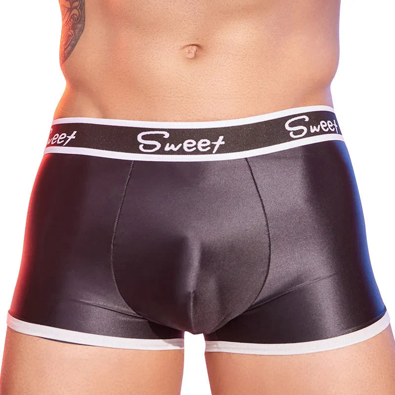 Men's shiny silky nylon boxer shorts in black, white, and sapphire blue colours.