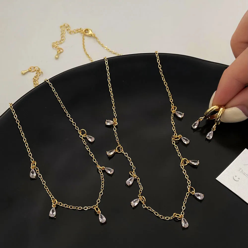 Zircon jewellery set showing necklace, earrings and anklet with geometric meteor shower design