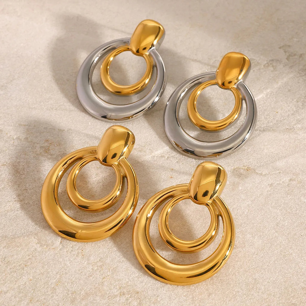 Golden round double layer hollow stud earrings with geometric design on titanium steel