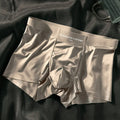 Men's solid colour Ice Silk boxer shorts with mid waist, shown in coffee, light grey, white, and blue.