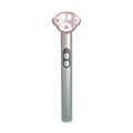 Gradient pink Cat's Paw micro-current eye massager with charging cable.