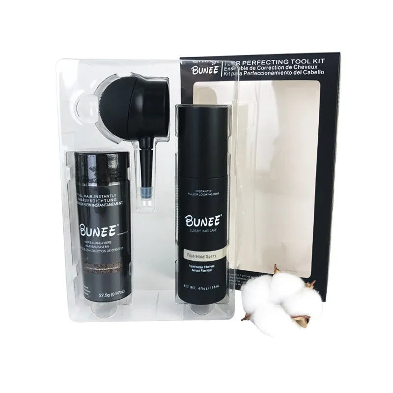 Boxed set of hair building fibre powder, styling spray and nozzle for volumising thin hair.