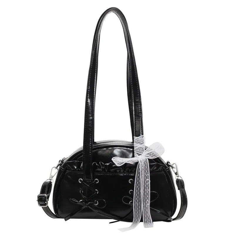 Women's fashion shoulder handbag with bandage bow design in PU leather showing interior phone pocket