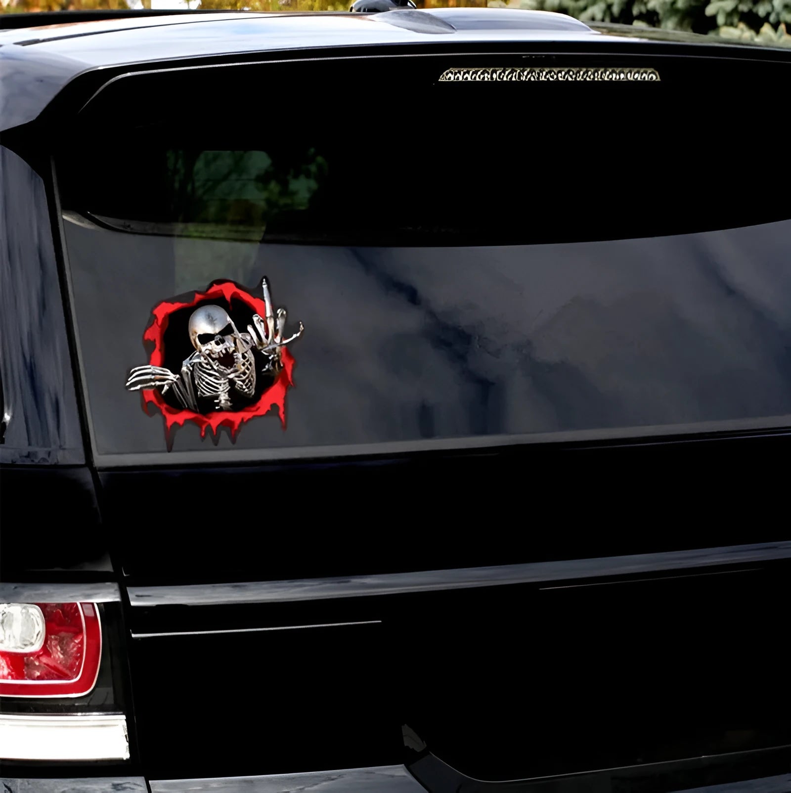 Printed reflective colourful broken shell and metal skull design car sticker measuring 15cm by 14cm.