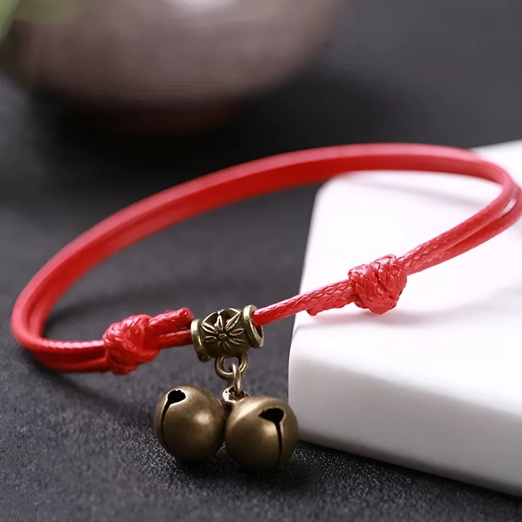 Adjustable nylon rope dog collar with a brass bell, shown in black, red, and coffee colour options.