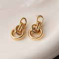 Geometric copper earrings for women in gold with irregular high-profile shape