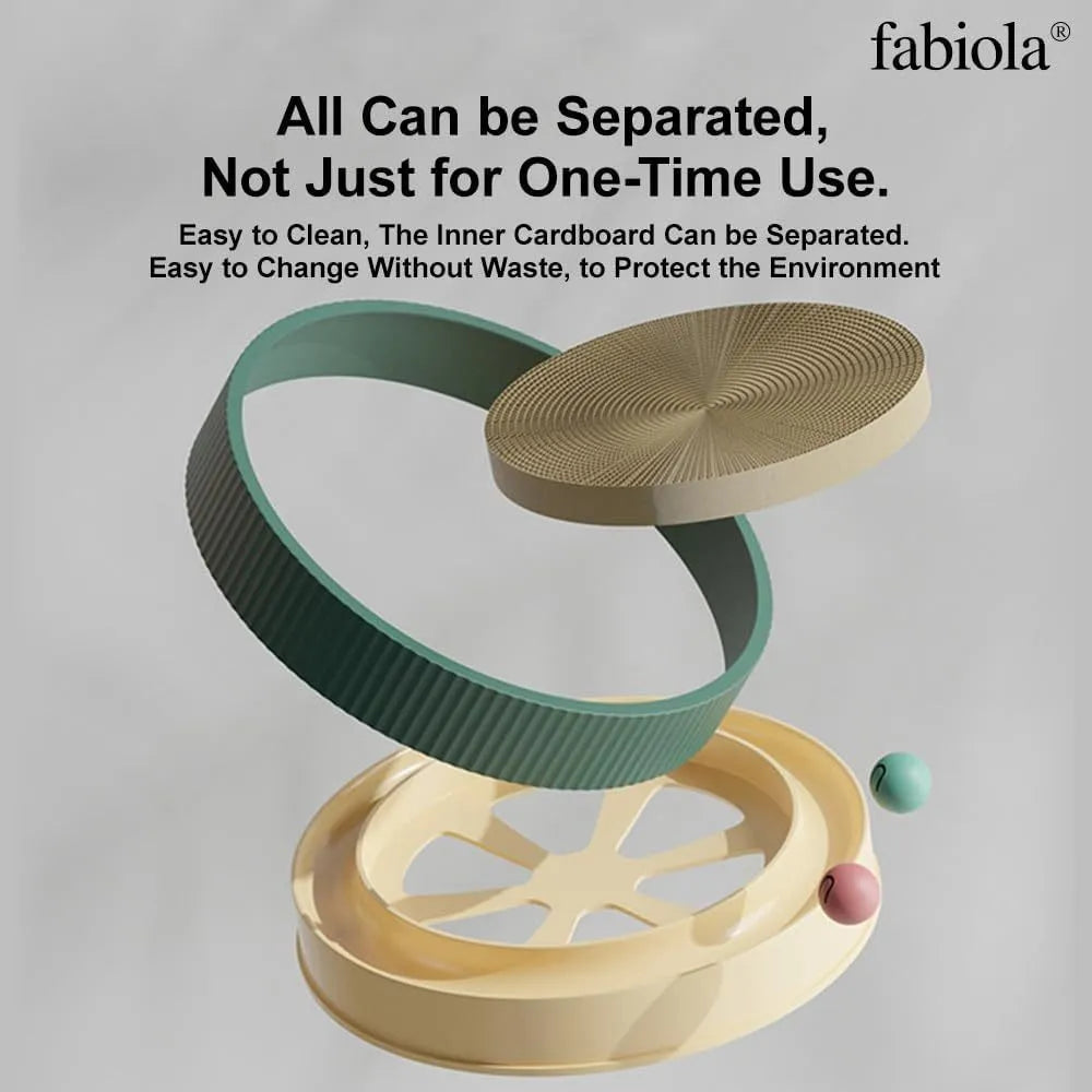 Large circular green cardboard cat scratching board with a central track containing two yellow balls and a spring-mounted plush ball.