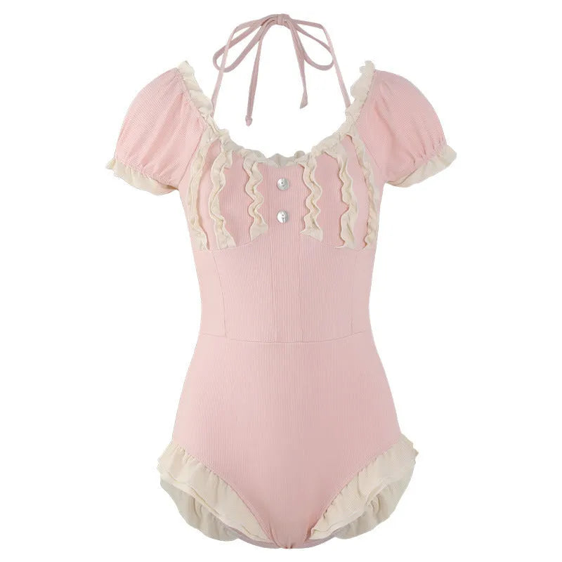 Women's pink one-piece nylon swimsuit with conservative design on mannequin