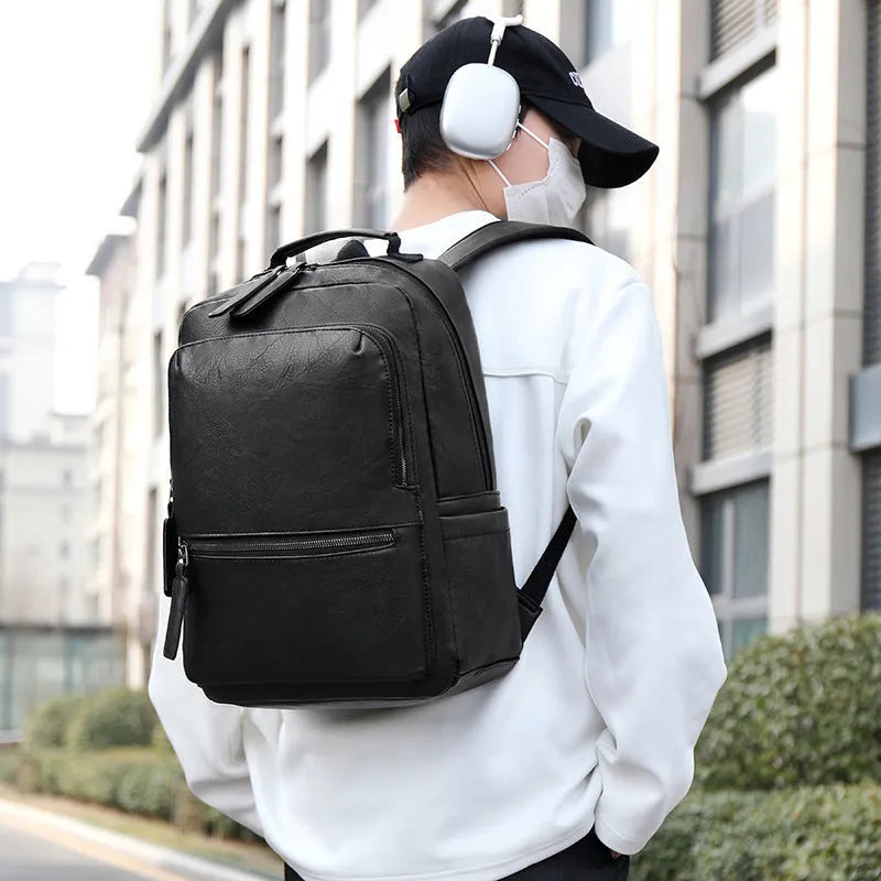 Men's vintage PU leather backpack in gray, 20-35L, with air cushion belt and patchwork accent