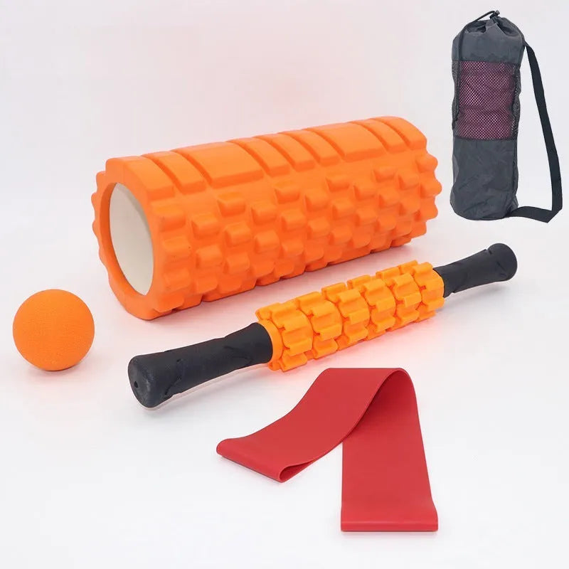 Black handheld foam massage roller bar with six white textured gear pieces on a 33cm shaft.