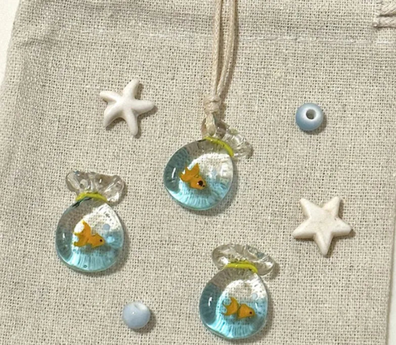 Women's pendant necklace with coloured glaze skirt joker character on a cotton linen clavicle chain.