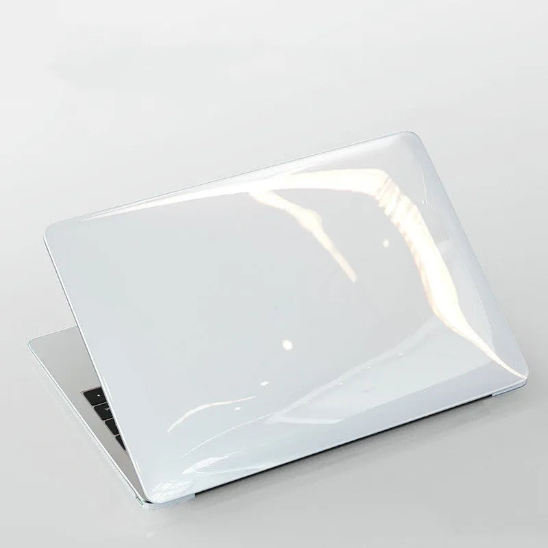 Transparent and black PC hard shell protective cases for Apple MacBook Pro 14.2 and 16.2-inch laptops.