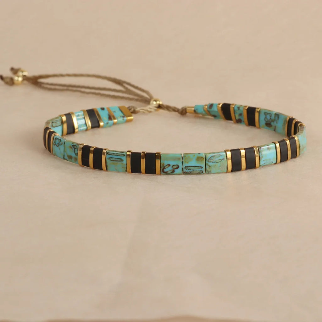 Geometric pull bead glass bracelet in multiple colour options on wrist