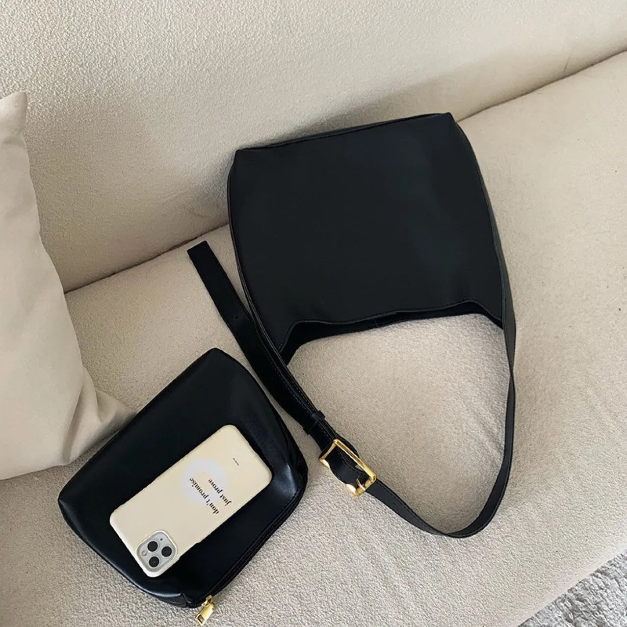 Women's soft PU leather shoulder bag with swing threads detail in black and brown colour options