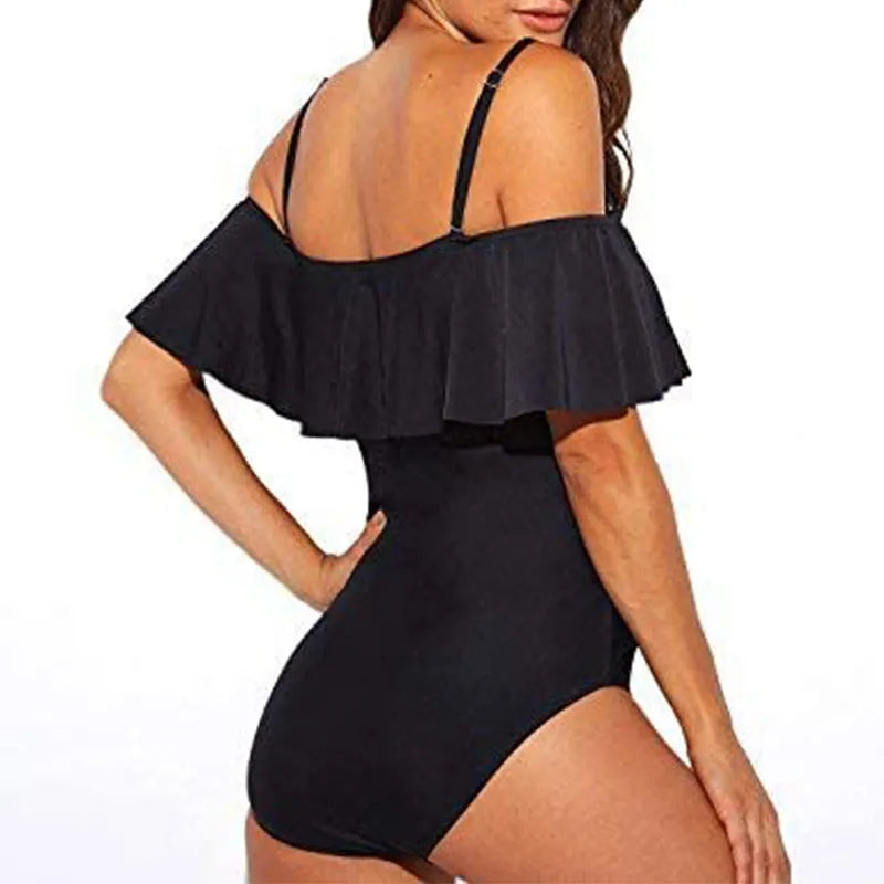 Black one-piece swimsuit with cut-out design and ruffled straps for swimming