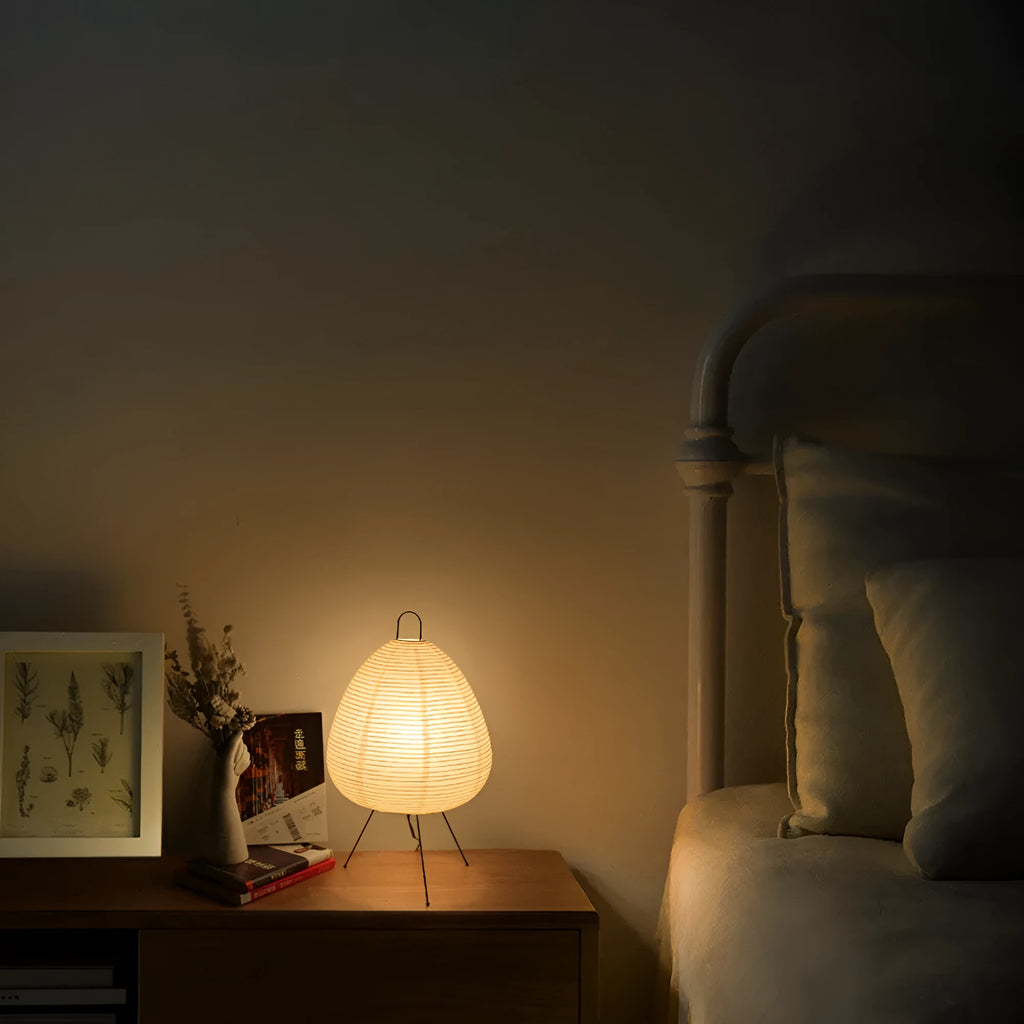 Japanese style rice paper table lamp with handmade shade and aluminium base on wooden surface