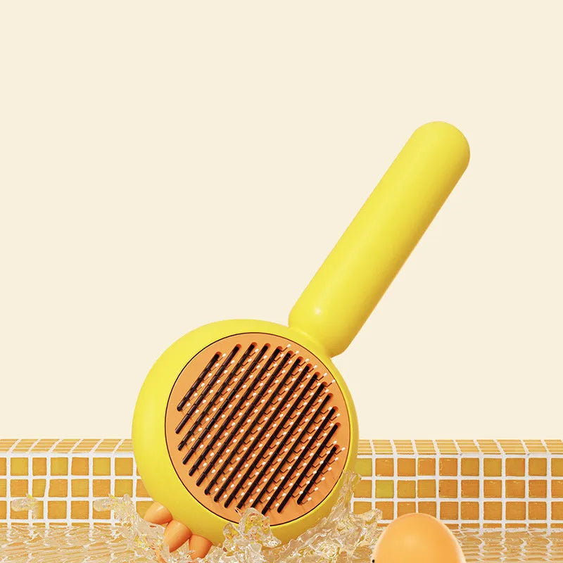 Purple self-cleaning pet grooming brush with stainless steel bristles and a one-button mechanism.
