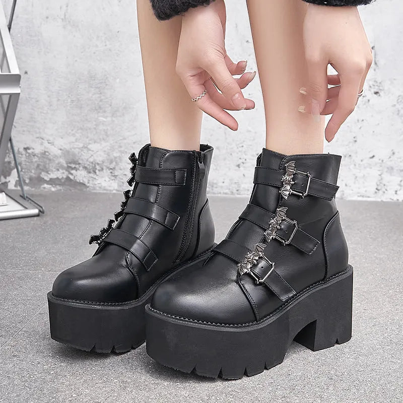 Black women's punk bat buckle gothic short boots with side zip and thick heel.