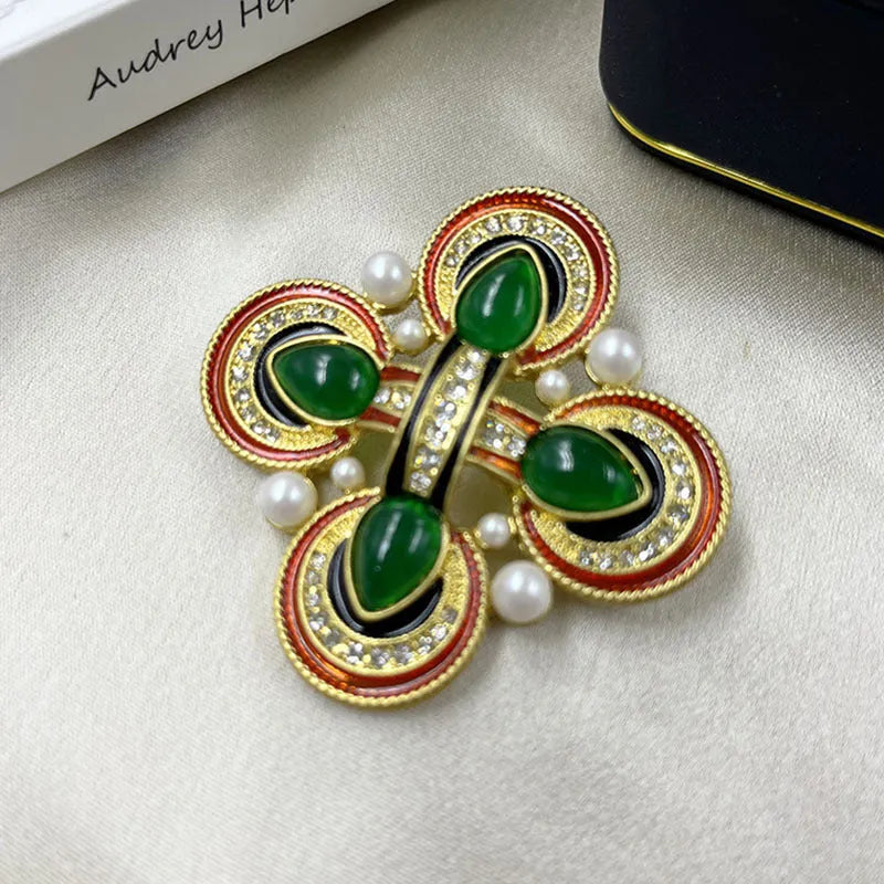 Close-up of a medieval-style baroque cross brooch with crystals, made from zinc alloy in a vintage colour finish.