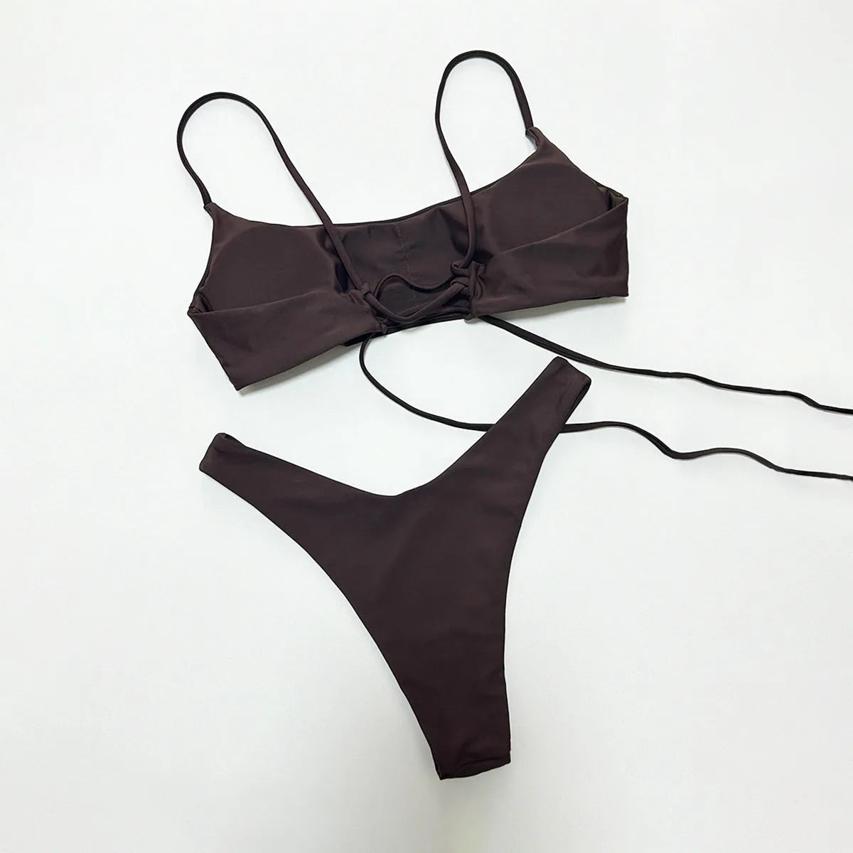 Solid colour split women's swimsuit in nylon, sleeveless one-piece, available in brown, beige, and black