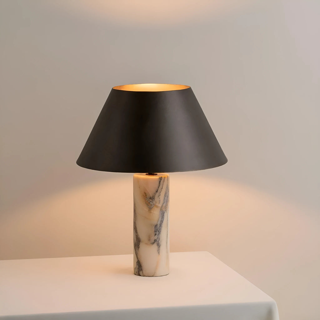 Black marble table lamp with modern design on wooden surface