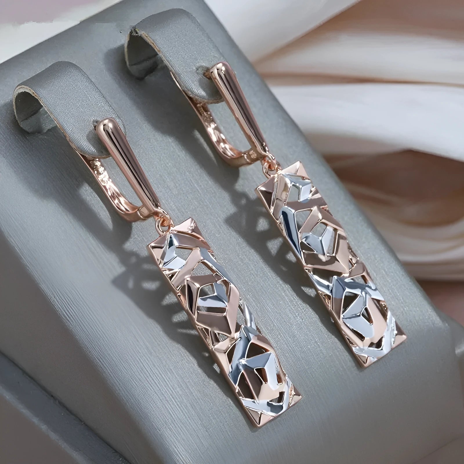 Rectangular hollow stud earrings with a two-tone picture style finish.