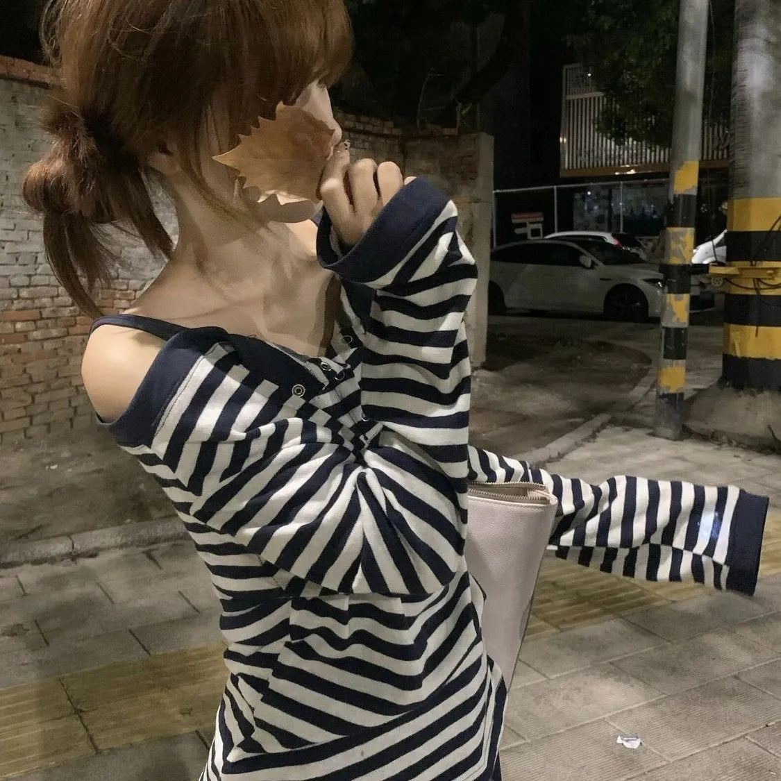 Dark blue striped women's oversized t-shirt with embroidery and button details