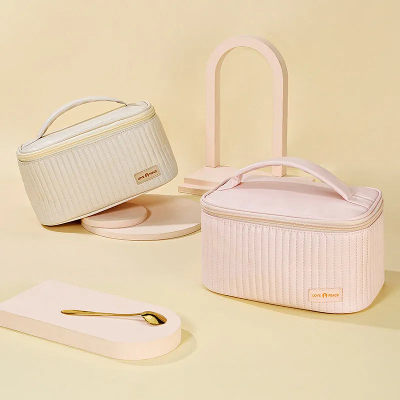 Open-top women's makeup bag in light blue PU leather with a solid colour design.