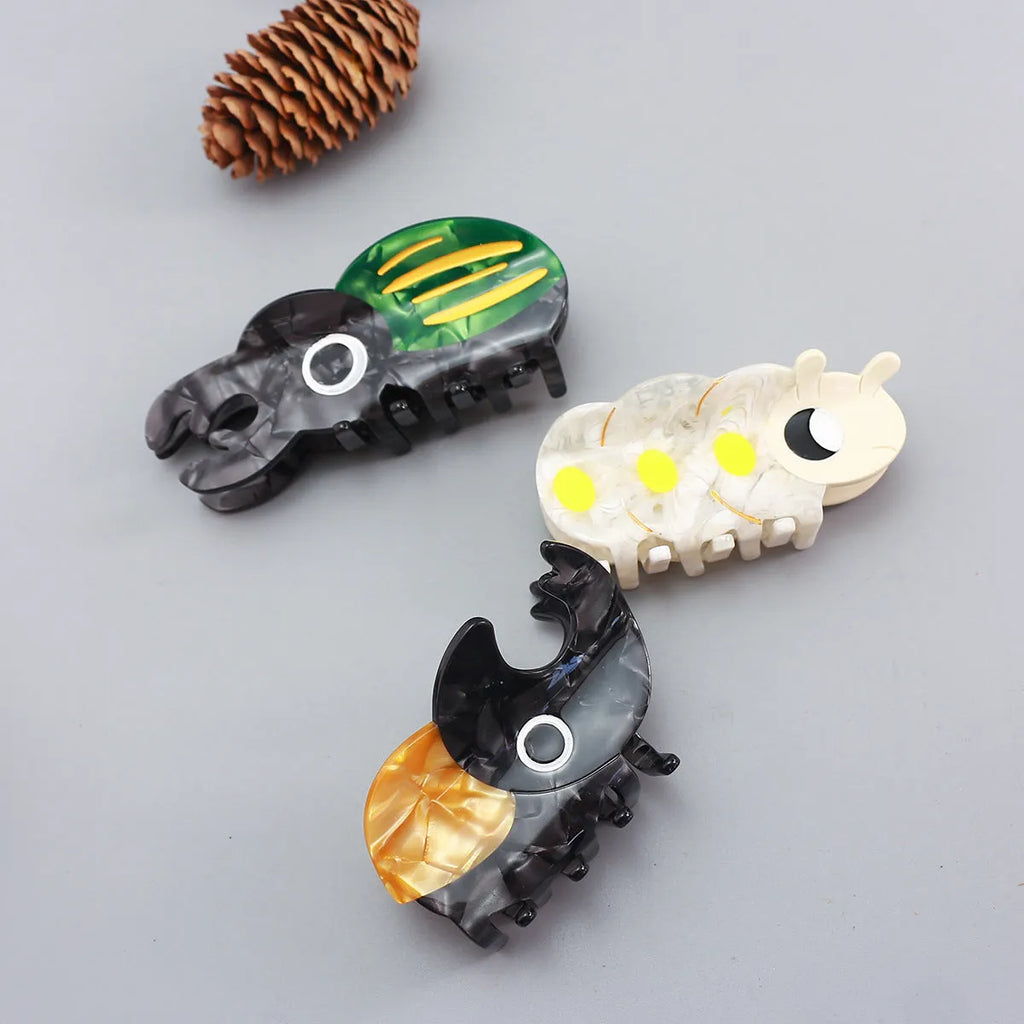 Handmade cellulose acetate insect brooch with beetle grip pin in green, orange, or white caterpillar designs
