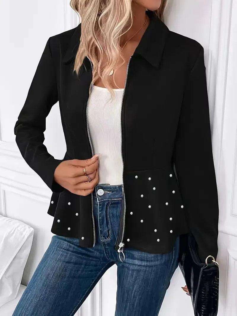 Women's black loose fit coat with beaded heavy-duty zipper and ruffled hem detail.