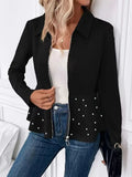 Women's black loose fit coat with beaded heavy-duty zipper and ruffled hem detail.